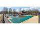 Community pool with covered area and basketball court at 2234 Oak Falls Ln, Buford, GA 30519