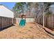 Fenced backyard with play structure provides a safe and fun outdoor space at 2417 Kingston Heath Way, Marietta, GA 30008