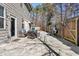 Spacious backyard patio with comfortable seating area, grill, and view of the fenced yard at 2417 Kingston Heath Way, Marietta, GA 30008