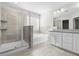 Beautiful bathroom featuring a glass enclosed shower, soaking tub and granite countertops at 2417 Kingston Heath Way, Marietta, GA 30008