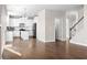 Open concept living room provides access to the kitchen, stairs and powder room at 2417 Kingston Heath Way, Marietta, GA 30008