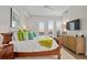 Bright bedroom with a comfortable bed and plenty of natural light at 58 Canton St # 304, Alpharetta, GA 30009