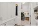 Bright laundry room with ample cabinetry and shelving at 58 Canton St # 304, Alpharetta, GA 30009