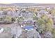 Aerial view showing a house, detached buildings, and surrounding trees at 87 Bradley Trl, Kingston, GA 30145