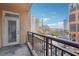 Apartment balcony showcasing expansive city views and a doorway to the outdoor space at 1101 Juniper Ne St # 415, Atlanta, GA 30309