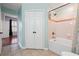 Bathroom with tub, shower, and double doors to closet at 1101 Juniper Ne St # 415, Atlanta, GA 30309