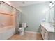 Bathroom featuring tile floors, a quartz vanity, and a shower/tub combo at 1101 Juniper Ne St # 415, Atlanta, GA 30309