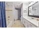 Bathroom featuring tile floors, a quartz vanity, and a shower/tub combo at 1101 Juniper Ne St # 415, Atlanta, GA 30309