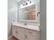 Bathroom with a modern quartz countertop, framed mirror, and tile flooring at 1101 Juniper Ne St # 415, Atlanta, GA 30309