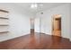 Bedroom with hardwood floors, ceiling fan, and built-in shelving units at 1101 Juniper Ne St # 415, Atlanta, GA 30309