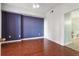 Bedroom with hardwood floors and purple accent wall at 1101 Juniper Ne St # 415, Atlanta, GA 30309