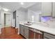 Modern kitchen with stainless steel appliances and white quartz countertops at 1101 Juniper Ne St # 415, Atlanta, GA 30309