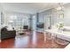 Spacious living room with hardwood floors and large windows at 1101 Juniper Ne St # 415, Atlanta, GA 30309