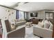 Inviting living room featuring neutral sofas, accent pillows, and a decorative TV wall at 1101 Juniper Ne St # 415, Atlanta, GA 30309