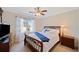 Bedroom with a sleigh bed and ceiling fan at 2440 Jamerson Rd, Marietta, GA 30066