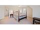 Bedroom with a post bed, carpet, and ensuite bathroom at 2440 Jamerson Rd, Marietta, GA 30066