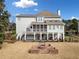 Two-story house with screened porch and fire pit in the backyard at 2440 Jamerson Rd, Marietta, GA 30066