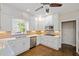 Renovated kitchen with white cabinets, stainless steel appliances, and hardwood floors at 2440 Jamerson Rd, Marietta, GA 30066