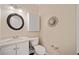 Small powder room with white vanity and granite countertop at 2440 Jamerson Rd, Marietta, GA 30066