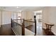 Upstairs hall with dark wood floors and metal railing at 2440 Jamerson Rd, Marietta, GA 30066