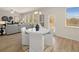 Casual dining area with white chairs and a round table, adjacent to kitchen at 3103 Steinbeck Way, East Point, GA 30344