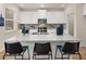 Kitchen island with granite countertop and seating for three at 3103 Steinbeck Way, East Point, GA 30344