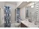 Bathroom with tub, white vanity, and blue patterned curtain at 3648 Peachtree Ne Rd # 3J, Atlanta, GA 30319