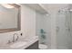 Modern bathroom with a large walk-in shower and gray vanity at 3648 Peachtree Ne Rd # 3J, Atlanta, GA 30319