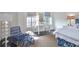 Bright bedroom with a sitting area and hardwood floors at 3648 Peachtree Ne Rd # 3J, Atlanta, GA 30319