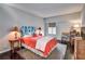 Bright bedroom with coral bedding and dark hardwood floors at 3648 Peachtree Ne Rd # 3J, Atlanta, GA 30319