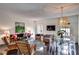 Living room with hardwood floors, a zebra rug, and wicker furniture at 3648 Peachtree Ne Rd # 3J, Atlanta, GA 30319