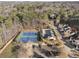 Aerial view of community tennis courts and swimming pool at 54 Devonshire Dr, Alpharetta, GA 30022