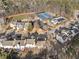 Aerial view showing homes and community tennis courts at 54 Devonshire Dr, Alpharetta, GA 30022