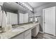 Double vanity bathroom with granite countertops and a shower/tub combo at 54 Devonshire Dr, Alpharetta, GA 30022