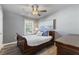 Charming bedroom with wood flooring and a ceiling fan at 54 Devonshire Dr, Alpharetta, GA 30022