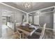 Dining room with hardwood floors, gray walls, and a farmhouse table at 54 Devonshire Dr, Alpharetta, GA 30022