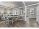 Bright dining room features hardwood floors and a farmhouse table at 54 Devonshire Dr, Alpharetta, GA 30022