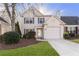 Two-story house with gray siding, attached garage, and manicured lawn at 54 Devonshire Dr, Alpharetta, GA 30022