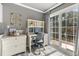 Home office with built-in desk and sliding glass doors to patio at 54 Devonshire Dr, Alpharetta, GA 30022