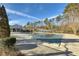 Community swimming pool with pool cover and surrounding landscaping at 54 Devonshire Dr, Alpharetta, GA 30022