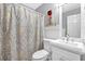 Clean bathroom with a white vanity and patterned shower curtain at 2713 Windsor Nw Ct, Kennesaw, GA 30144