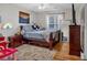 Cozy bedroom with hardwood floors and a double bed at 2713 Windsor Nw Ct, Kennesaw, GA 30144