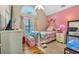 Charming bedroom with a pink accent wall and plenty of natural light at 2713 Windsor Nw Ct, Kennesaw, GA 30144