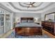 Bright bedroom with a king-size bed and hardwood floors at 2713 Windsor Nw Ct, Kennesaw, GA 30144