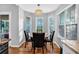 Bright dining area with a round table, four chairs, and a bay window at 2713 Windsor Nw Ct, Kennesaw, GA 30144