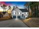 Two-story house with gray shutters, a two-car garage, and a deck at dusk at 2713 Windsor Nw Ct, Kennesaw, GA 30144