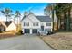 Two-story house with gray shutters, a two-car garage, and a deck at 2713 Windsor Nw Ct, Kennesaw, GA 30144