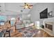 Relaxing living room with hardwood floors, fireplace and access to the kitchen at 2713 Windsor Nw Ct, Kennesaw, GA 30144