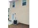 Tan vinyl-sided home with back door and AC unit at 5464 Sierra Trl, College Park, GA 30349