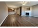 Open living room with hardwood floors and fireplace at 5464 Sierra Trl, College Park, GA 30349